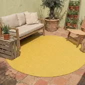 NATURL. Tapis d'extérieur rond - Costa Jaune Ocre | Ø 100 cm | Rond | Tissage plat