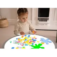TickiT Jouets éducatifs Set de coquillages transparents multicolores