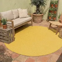 NATURL. Tapis d'extérieur rond - Costa Jaune Ocre | Ø 100 cm | Rond | Tissage plat