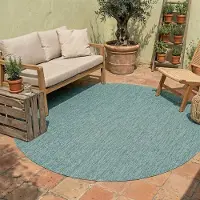 NATURL. Tapis d'extérieur rond - Costa Turquoise | Ø 100 cm | Rond | Tissage plat