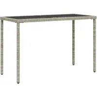 vidaXL Table de jardin avec plateau en verre gris clair 115x54x74 cm Poly rotin