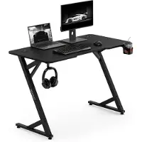 Sense7 Bureau de jeu VAMO, 120x60 cm, noir. Bureau d'ordinateur, bureau PC, design carbone, forme en Z, avec porte-boissons. Idéal pour le gaming, le télétravail et le bureau à domicile