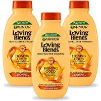 Garnier 3 bouteilles de shampooing Loving Blends, gamme "Honoring Goud", pour cheveux abîmés et cassants, 300 ml. Pack économique - 3 pièces